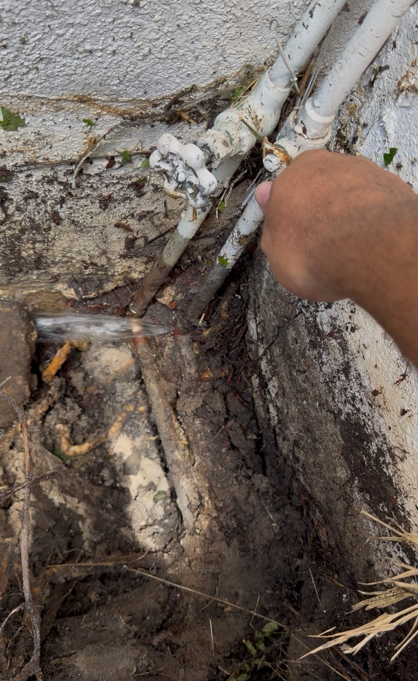 Old corroded outdoor water line and shutoff assembly before emergency plumbing repair in Clearwater FL