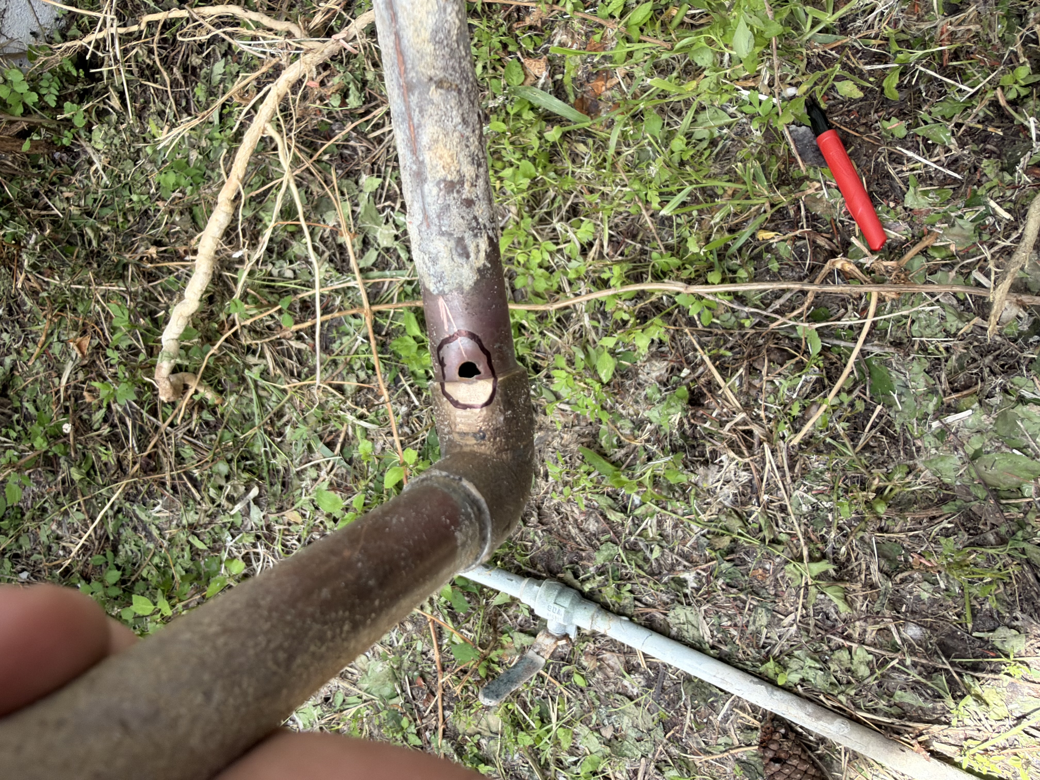 Close up of damaged outdoor copper water line before repair in Clearwater FL