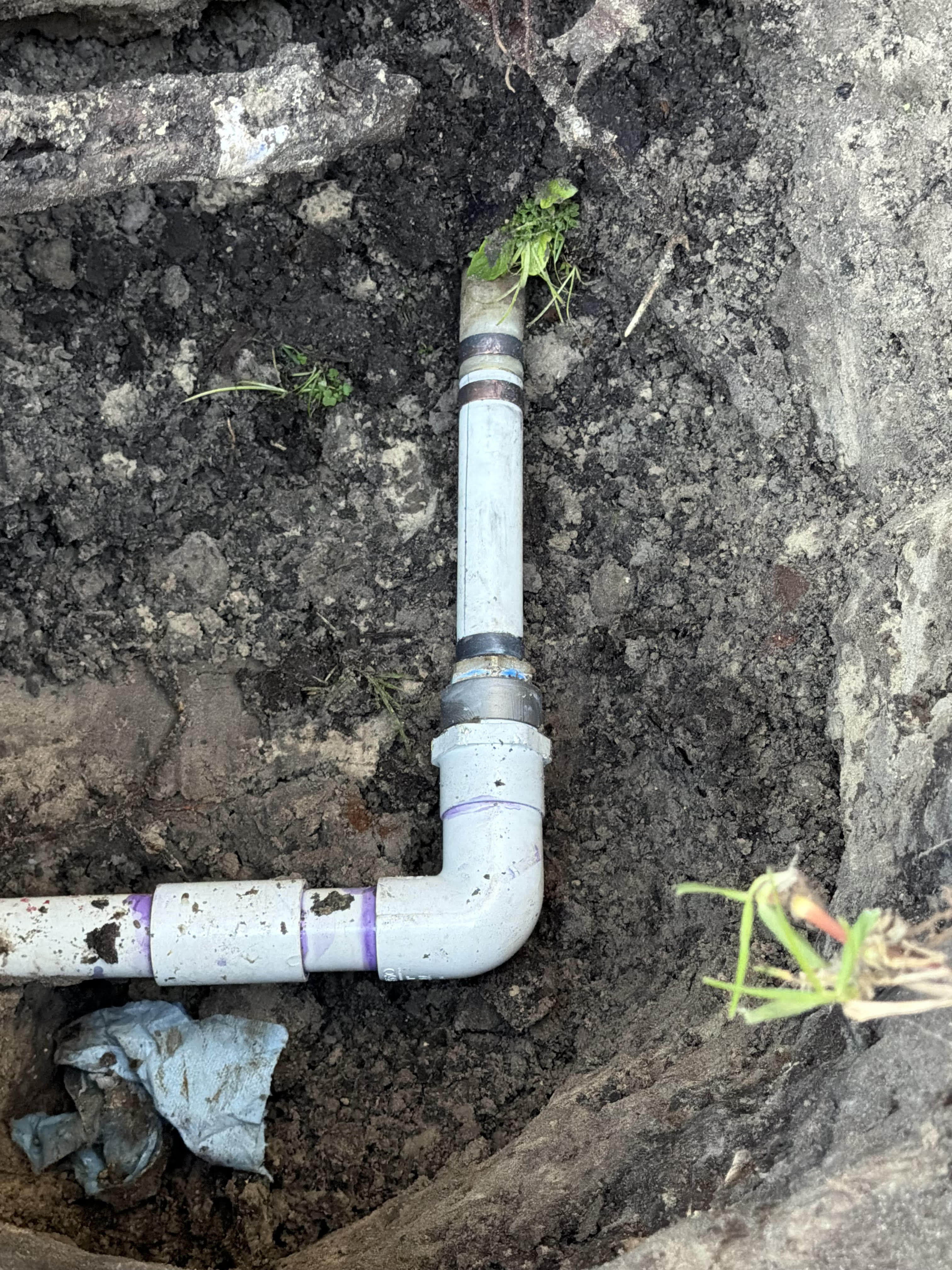 Completed outdoor plumbing leak repair at Clearwater home