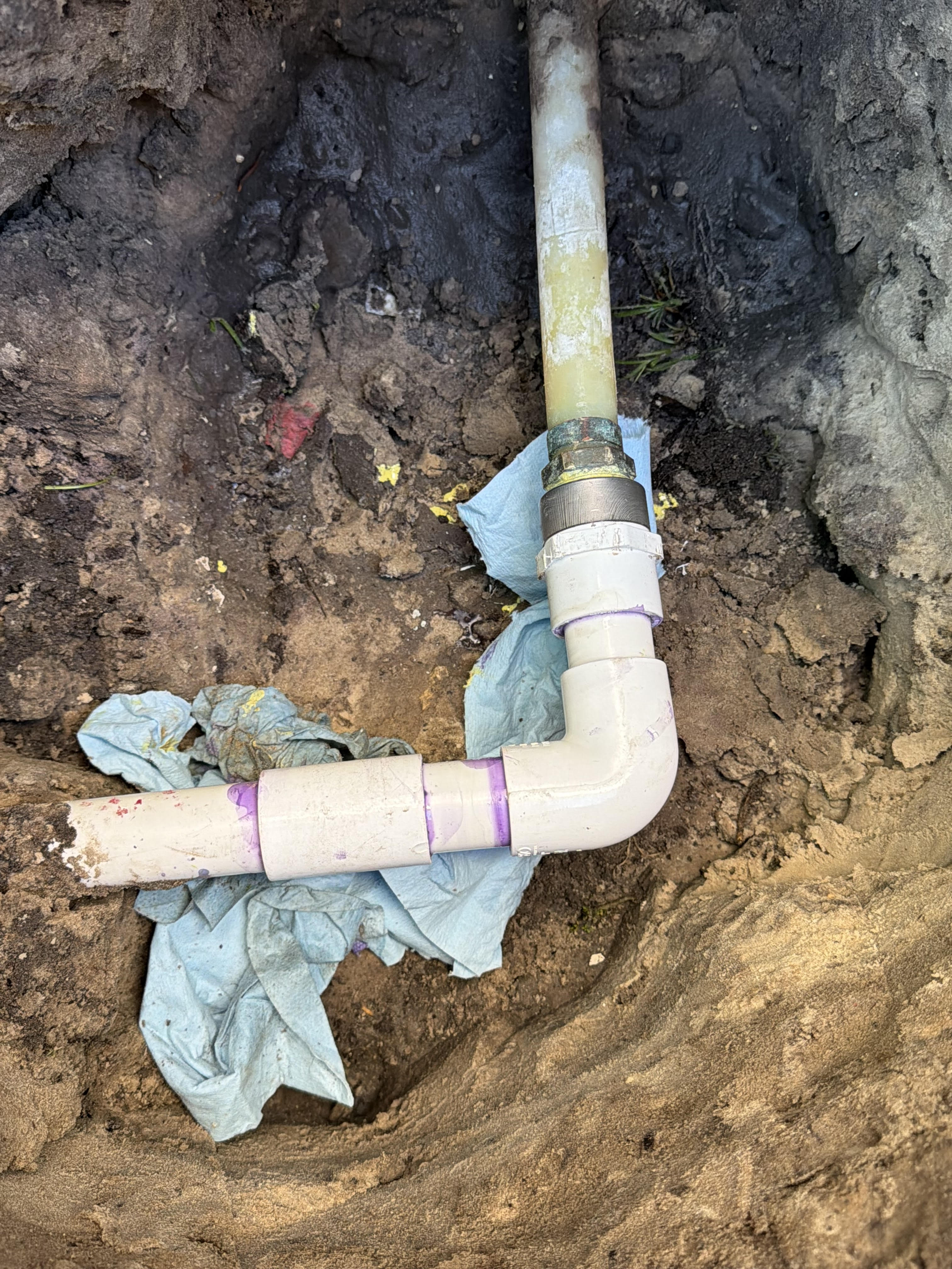 Outdoor emergency plumbing repair in progress in Clearwater Florida